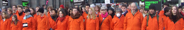 Demonstrators recreating the Guantanamo Bay submission position in the heart of Edinburgh