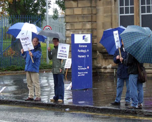 EIS members & supporters outside Telford College gate in the rain