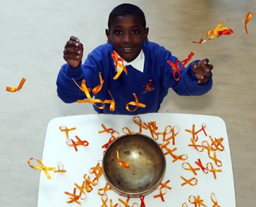 A Forthview Primary pupil creates a shower of saffron ribbons