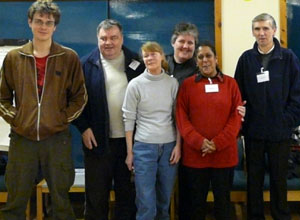 Three women and three men grouped for a photo