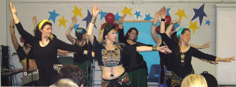 Two rows of women tribal belly dancing