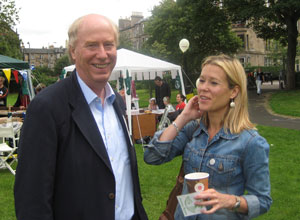 Malcom in an open necked shirt with Jenny in a blue denim jacket