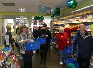 Shoppers walking into the refurbished store