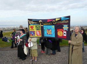 Workers Education Association banner, themed yellow blue and red on a black background