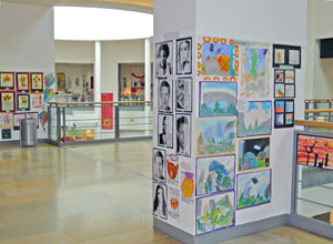 Various posters displayed on pillars in Ocean Terminal