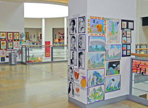 Various posters displayed on pillars in Ocean Terminal