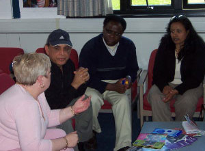 Two women and men sitting in discussion at the second Leith Open Space event in 2006