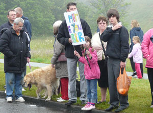 Girl around nine with banner