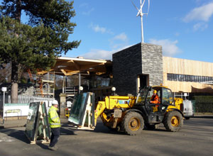 Windows being collected by a fork lift truck at the East Gate entrance