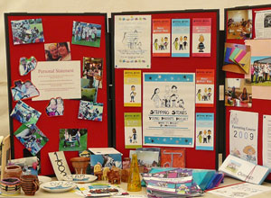 Posters on a red display board