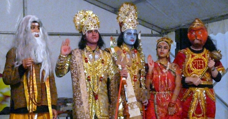 The victorious wedding party with palms raised
