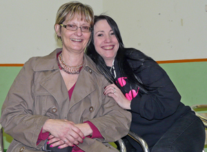 Jai Adami and Pam McNamee seated, smiling