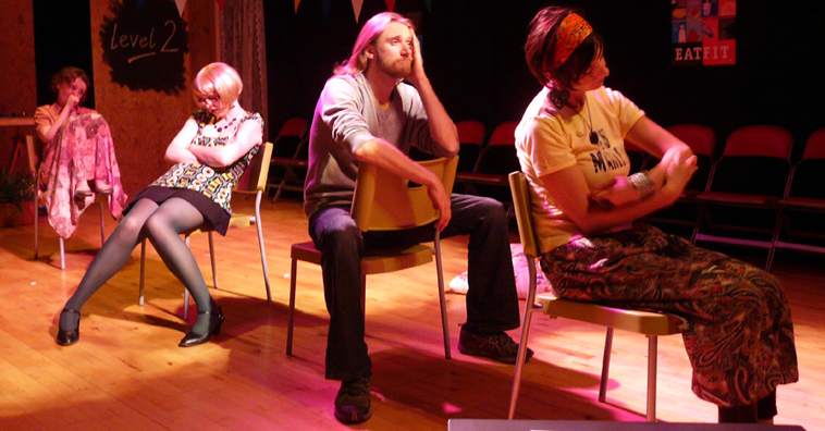 File of seated actors representing four different stages in a man's life