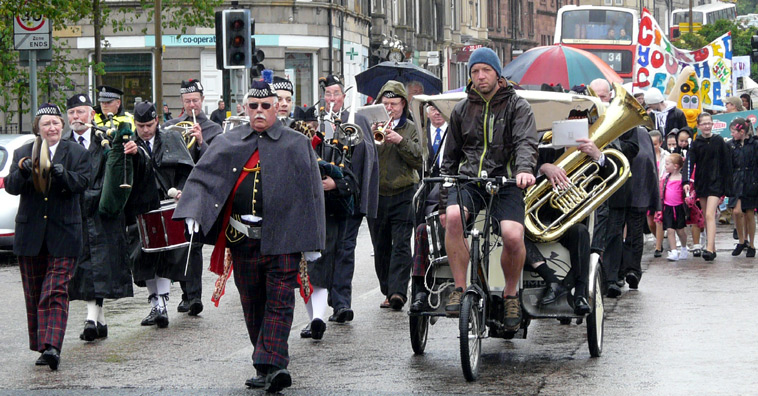 Fred Frayling-Kelly leads the Leith Community Concert Band along Links Gardens