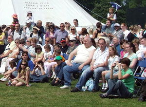 Seated Leithers watch the show